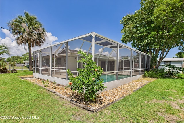 959 Eyerly Ln NE, Palm Bay, FL 32905 - rear view of property with a yard and an outdoor pool