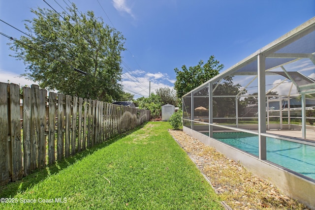 959 Eyerly Ln NE, Palm Bay, FL 32905 - fenced backyard with a storage unit and glass enclosure