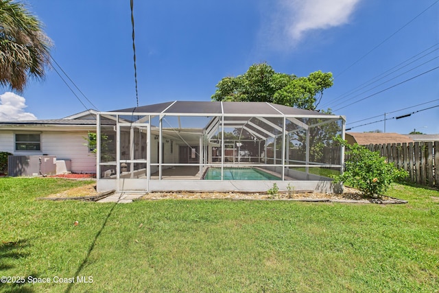 959 Eyerly Ln NE, Palm Bay, FL 32905 - rear view of house with a lanai