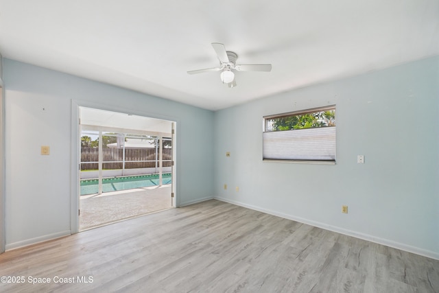 959 Eyerly Ln NE, Palm Bay, FL 32905 - empty room featuring a ceiling fan and wood finished floors