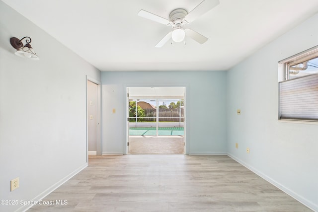 959 Eyerly Ln NE, Palm Bay, FL 32905 - unfurnished room featuring a ceiling fan and light wood-style floors