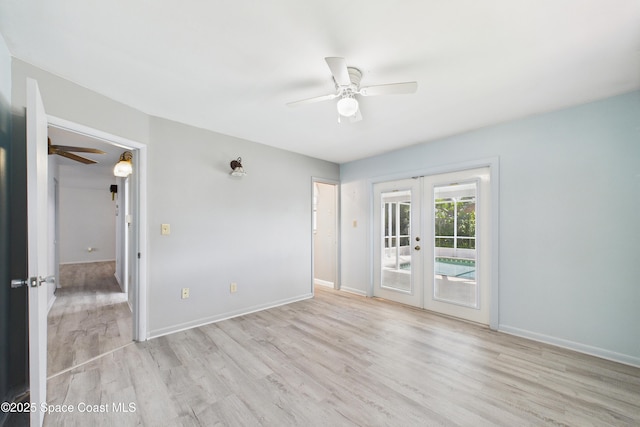 959 Eyerly Ln NE, Palm Bay, FL 32905 - unfurnished room with french doors, a ceiling fan, and light wood-style flooring