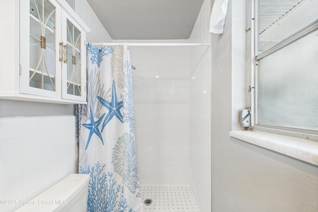959 Eyerly Ln NE, Palm Bay, FL 32905 - bathroom with tiled shower and tile walls