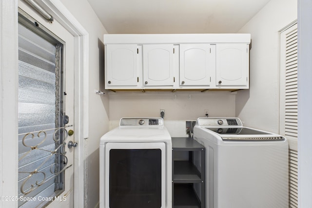 959 Eyerly Ln NE, Palm Bay, FL 32905 - laundry area with cabinet space and washer and clothes dryer