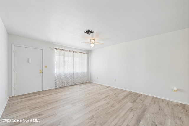 959 Eyerly Ln NE, Palm Bay, FL 32905 - empty room with light wood-style floors and a ceiling fan