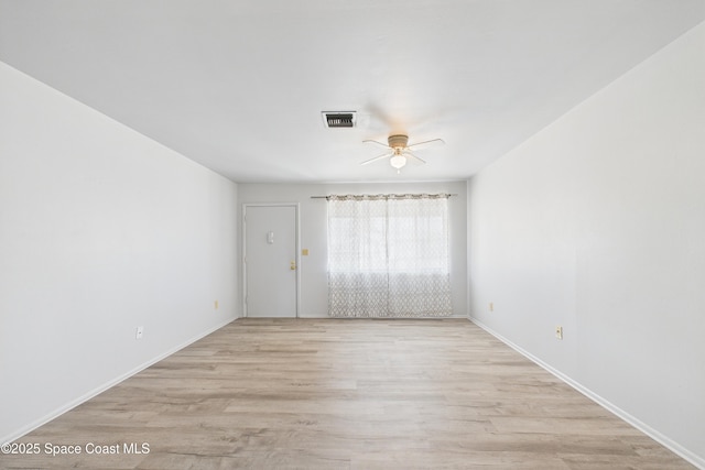 959 Eyerly Ln NE, Palm Bay, FL 32905 - empty room featuring ceiling fan and light wood-style flooring