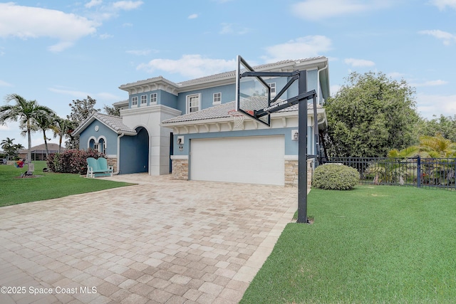 view of front of home featuring decorative driveway, stone siding, and stucco siding