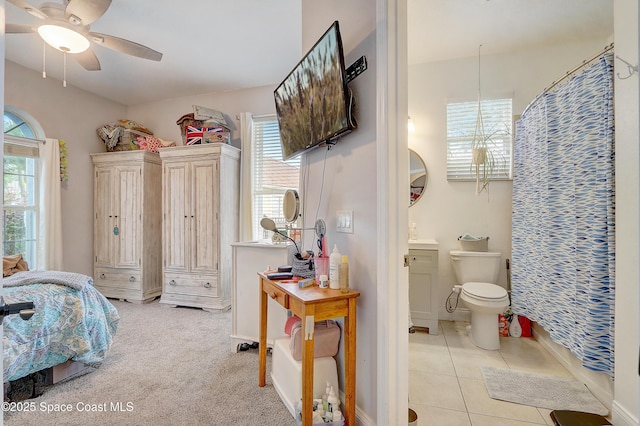 tiled bedroom featuring baseboards