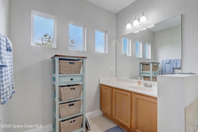 bathroom with tile patterned flooring and vanity