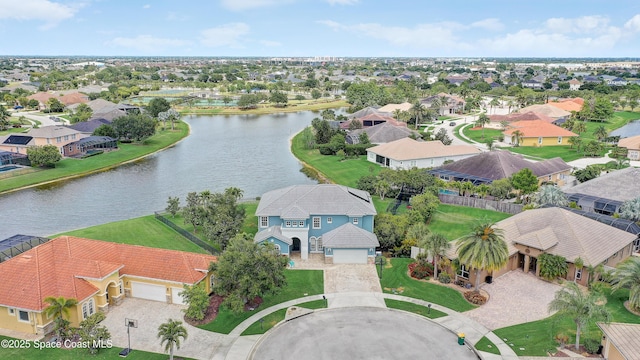 aerial perspective of suburban area with a large body of water
