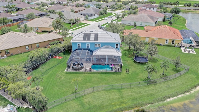 aerial view of residential area with a pool
