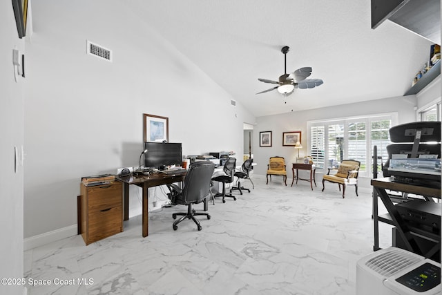 home office with marble look tiles, a ceiling fan, baseboards, a textured ceiling, and high vaulted ceiling