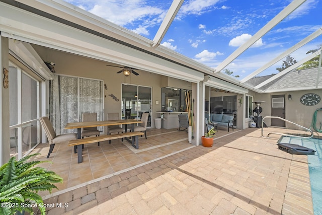 view of patio with a lanai and ceiling fan