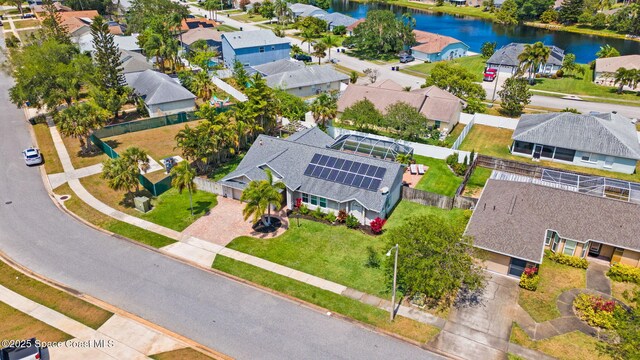 aerial perspective of suburban area featuring a large body of water