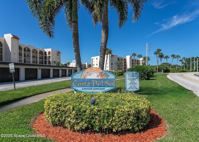 5807 N Atlantic Ave Unit 521, Cape Canaveral, FL 32920 - community / neighborhood sign with community garages and a lawn