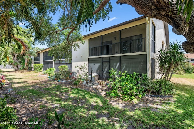 5807 N Atlantic Ave Unit 521, Cape Canaveral, FL 32920 - back of house with stucco siding