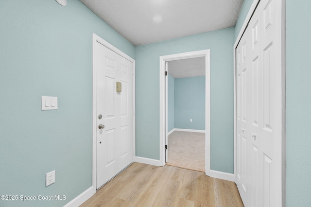 5807 N Atlantic Ave Unit 521, Cape Canaveral, FL 32920 - entryway with light wood-style flooring and baseboards