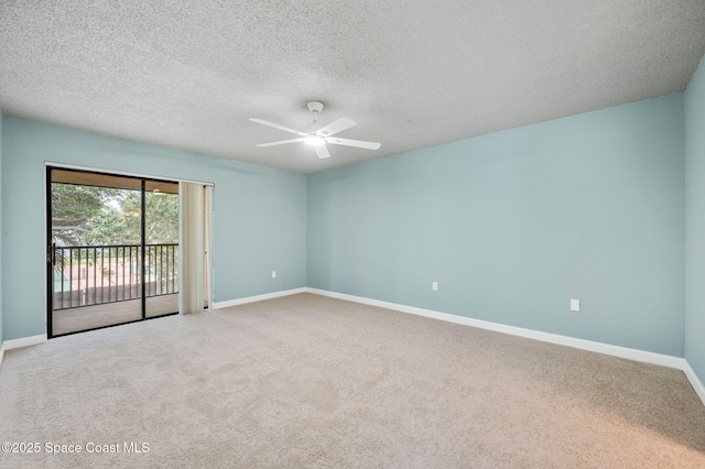 5807 N Atlantic Ave Unit 521, Cape Canaveral, FL 32920 - spare room with a ceiling fan, baseboards, carpet, and a textured ceiling
