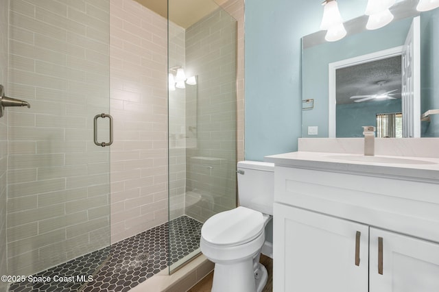 5807 N Atlantic Ave Unit 521, Cape Canaveral, FL 32920 - bathroom featuring a shower stall, toilet, and vanity