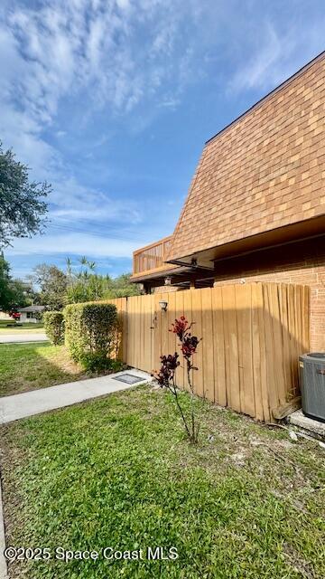 1648 S Park Ave, Titusville, FL 32780 - view of grassy yard with cooling unit