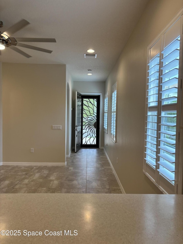 3455 Sedge Dr, Rockledge, FL 32955 - entrance foyer with ceiling fan, recessed lighting, and arched walkways