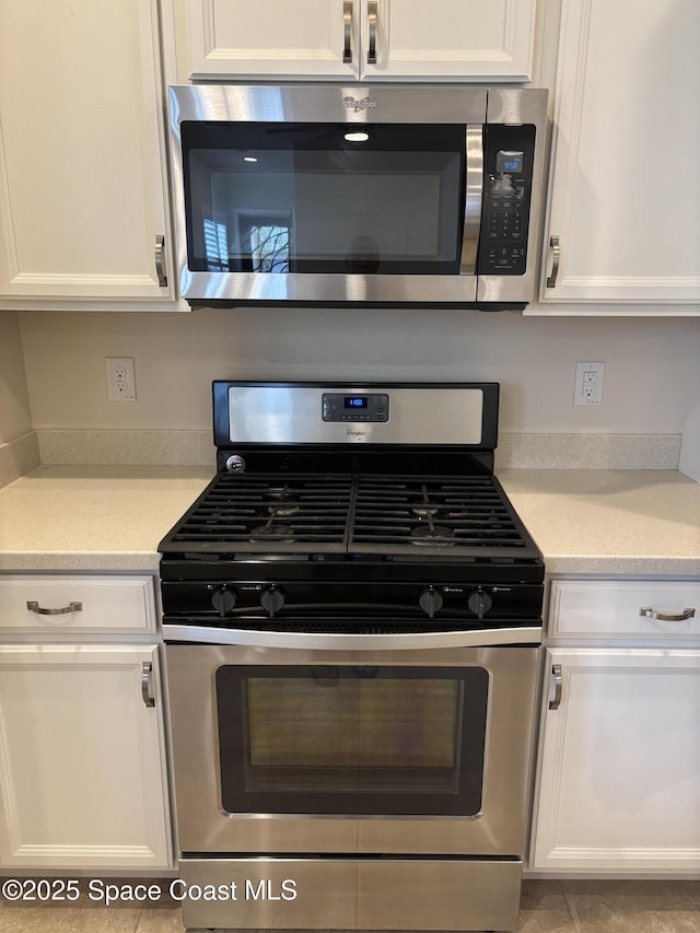3455 Sedge Dr, Rockledge, FL 32955 - kitchen featuring stainless steel appliances, white cabinetry, and light countertops