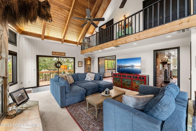 living room with wooden ceiling, high vaulted ceiling, beam ceiling, and ceiling fan