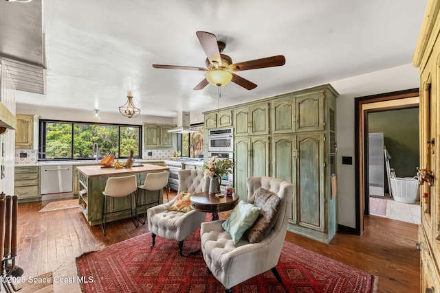 living room with dark wood-style flooring and ceiling fan