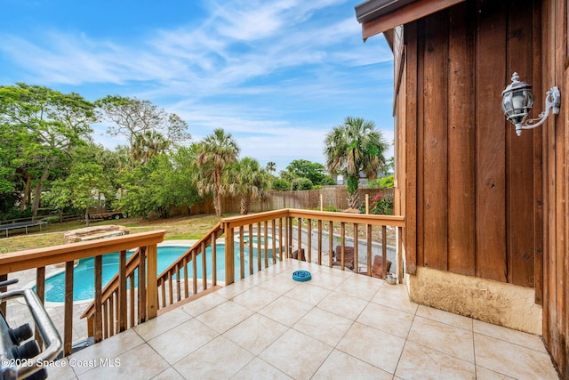view of patio / terrace with a fenced backyard and a trampoline
