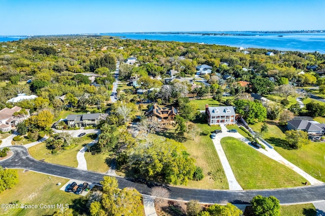 aerial perspective of suburban area featuring a nearby body of water