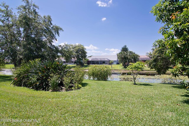 1132 Cypress Trace Dr, Melbourne, FL 32940 - view of grassy yard with a water view