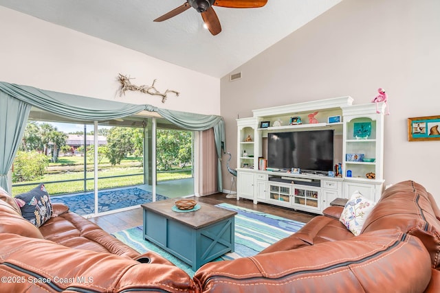 1132 Cypress Trace Dr, Melbourne, FL 32940 - living area with a ceiling fan, wood finished floors, healthy amount of natural light, and high vaulted ceiling