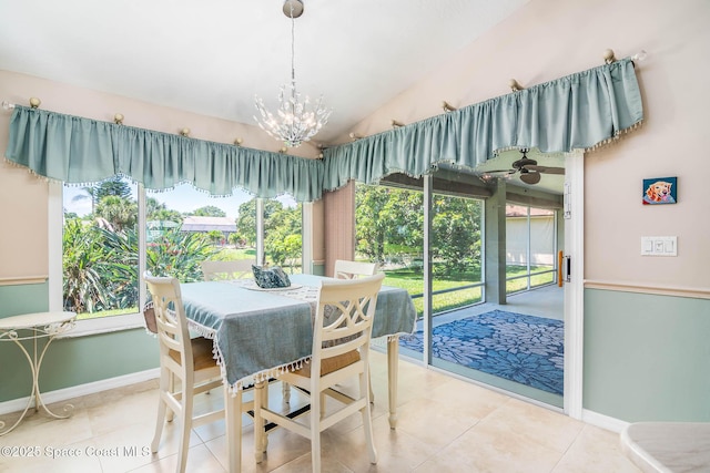 1132 Cypress Trace Dr, Melbourne, FL 32940 - tiled dining space featuring a chandelier, vaulted ceiling, plenty of natural light, and baseboards