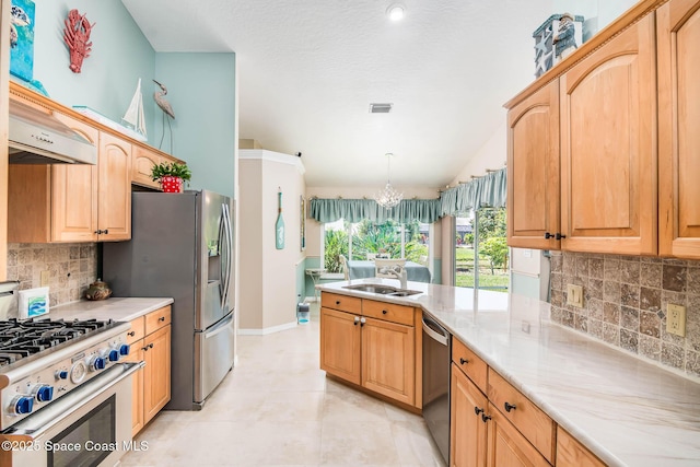 1132 Cypress Trace Dr, Melbourne, FL 32940 - kitchen with a sink, stainless steel appliances, a chandelier, tasteful backsplash, and light tile patterned floors