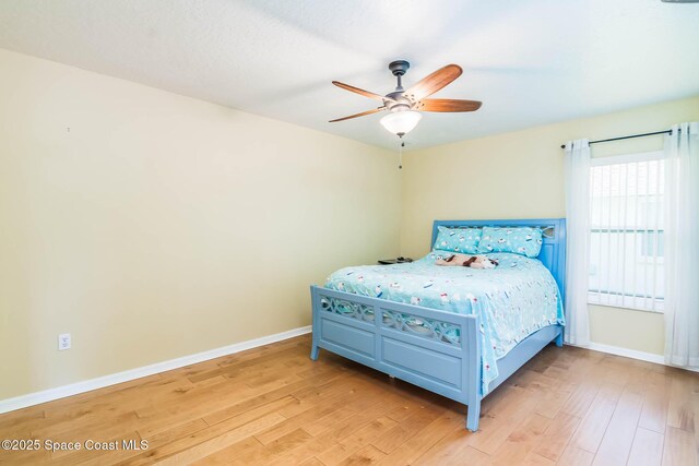 1132 Cypress Trace Dr, Melbourne, FL 32940 - bedroom featuring light wood finished floors, baseboards, and ceiling fan