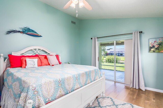 1132 Cypress Trace Dr, Melbourne, FL 32940 - bedroom with access to exterior, wood finished floors, a ceiling fan, and baseboards