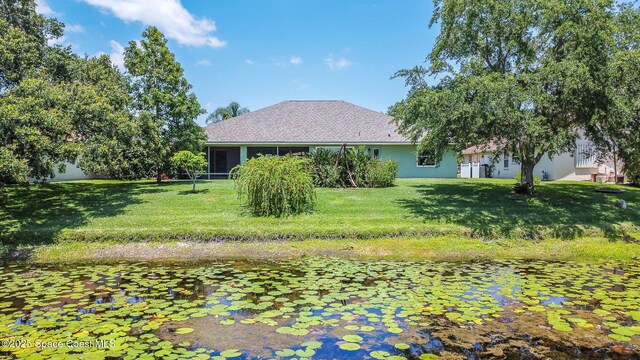 1132 Cypress Trace Dr, Melbourne, FL 32940 - view of grassy yard featuring a sunroom