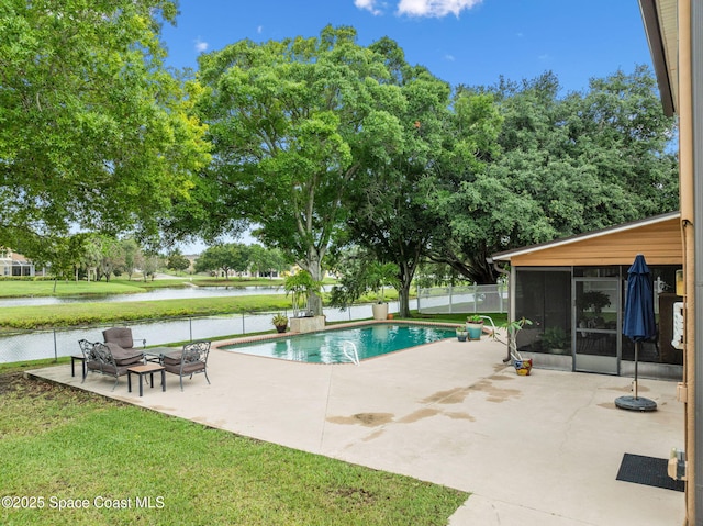 2449 Willowbrook Rd, Merritt Island, FL 32952 - view of pool featuring a patio, a sunroom, and a water view