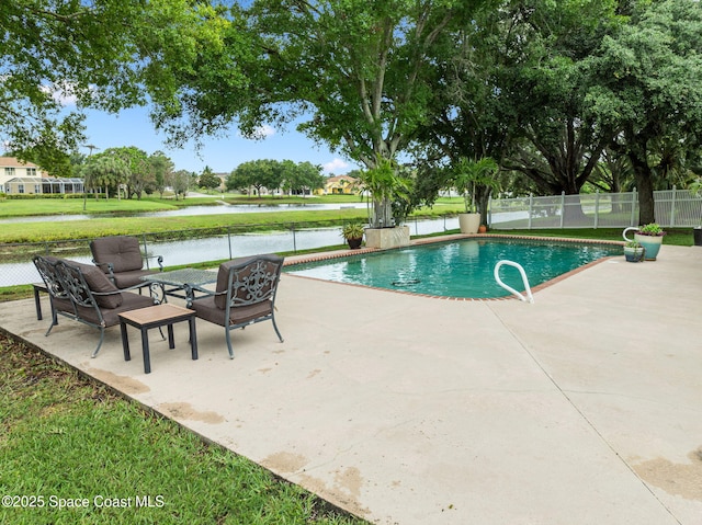 2449 Willowbrook Rd, Merritt Island, FL 32952 - view of swimming pool featuring a patio, fence, and a water view