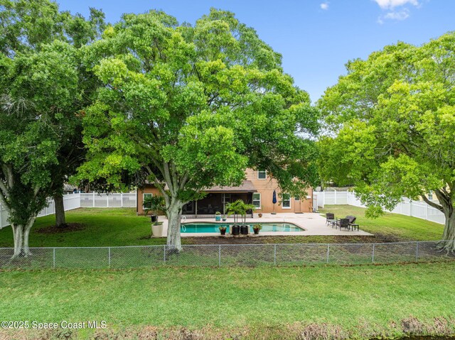 2449 Willowbrook Rd, Merritt Island, FL 32952 - view of yard with a patio area