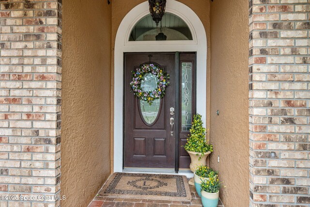 2449 Willowbrook Rd, Merritt Island, FL 32952 - entrance to property with stucco siding and brick siding
