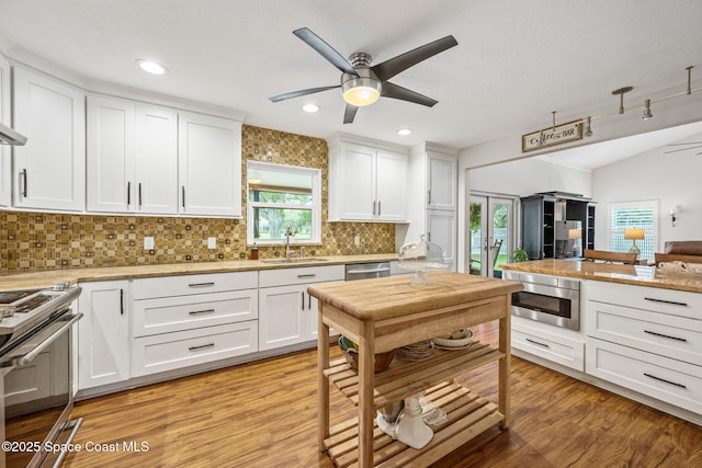 2449 Willowbrook Rd, Merritt Island, FL 32952 - kitchen featuring ceiling fan, appliances with stainless steel finishes, open floor plan, tasteful backsplash, and recessed lighting