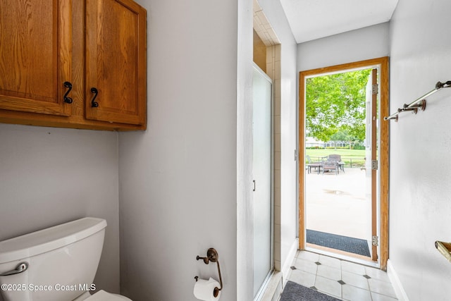 2449 Willowbrook Rd, Merritt Island, FL 32952 - full bathroom with a shower stall, toilet, and baseboards