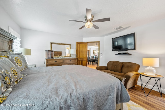 2449 Willowbrook Rd, Merritt Island, FL 32952 - bedroom featuring light wood finished floors, baseboards, and a ceiling fan