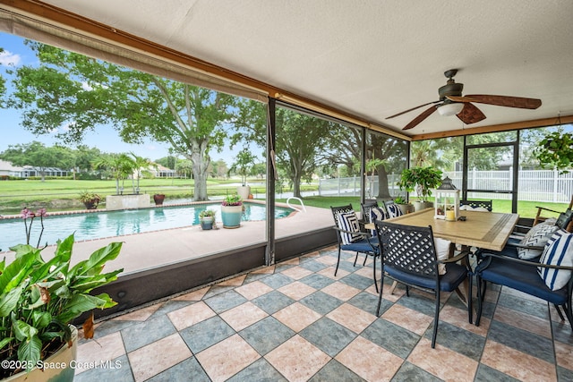 2449 Willowbrook Rd, Merritt Island, FL 32952 - sunroom / solarium featuring a ceiling fan and outdoor dining space