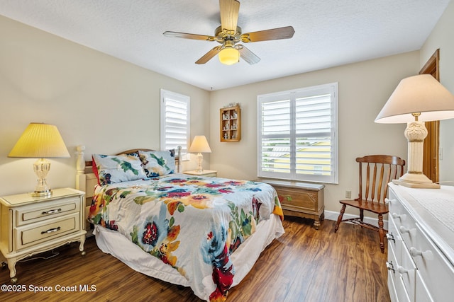 2449 Willowbrook Rd, Merritt Island, FL 32952 - bedroom with dark wood-style flooring, ceiling fan, and a textured ceiling