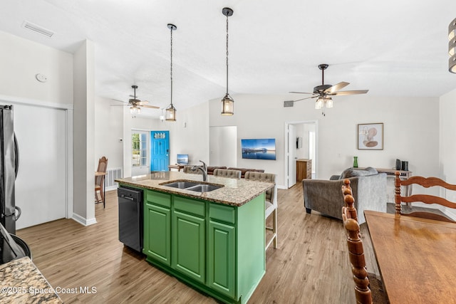 kitchen with black dishwasher, a ceiling fan, open floor plan, green cabinets, and lofted ceiling