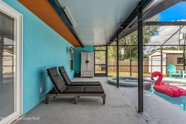 sunroom / solarium with a jacuzzi