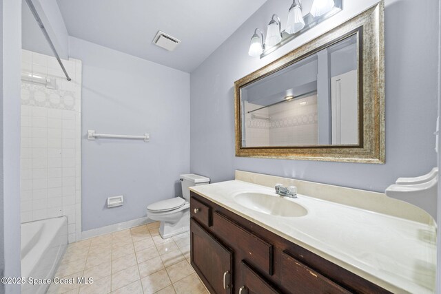 255 S Tropical Trl Unit B3, Merritt Island, FL 32952 - bathroom featuring vanity, toilet, tile patterned floors, baseboards, and shower / tub combination