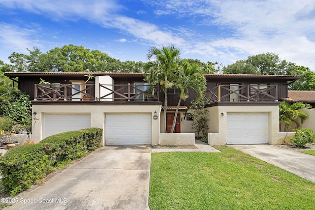 255 S Tropical Trl Unit B3, Merritt Island, FL 32952 - view of property with concrete driveway, a balcony, and stucco siding